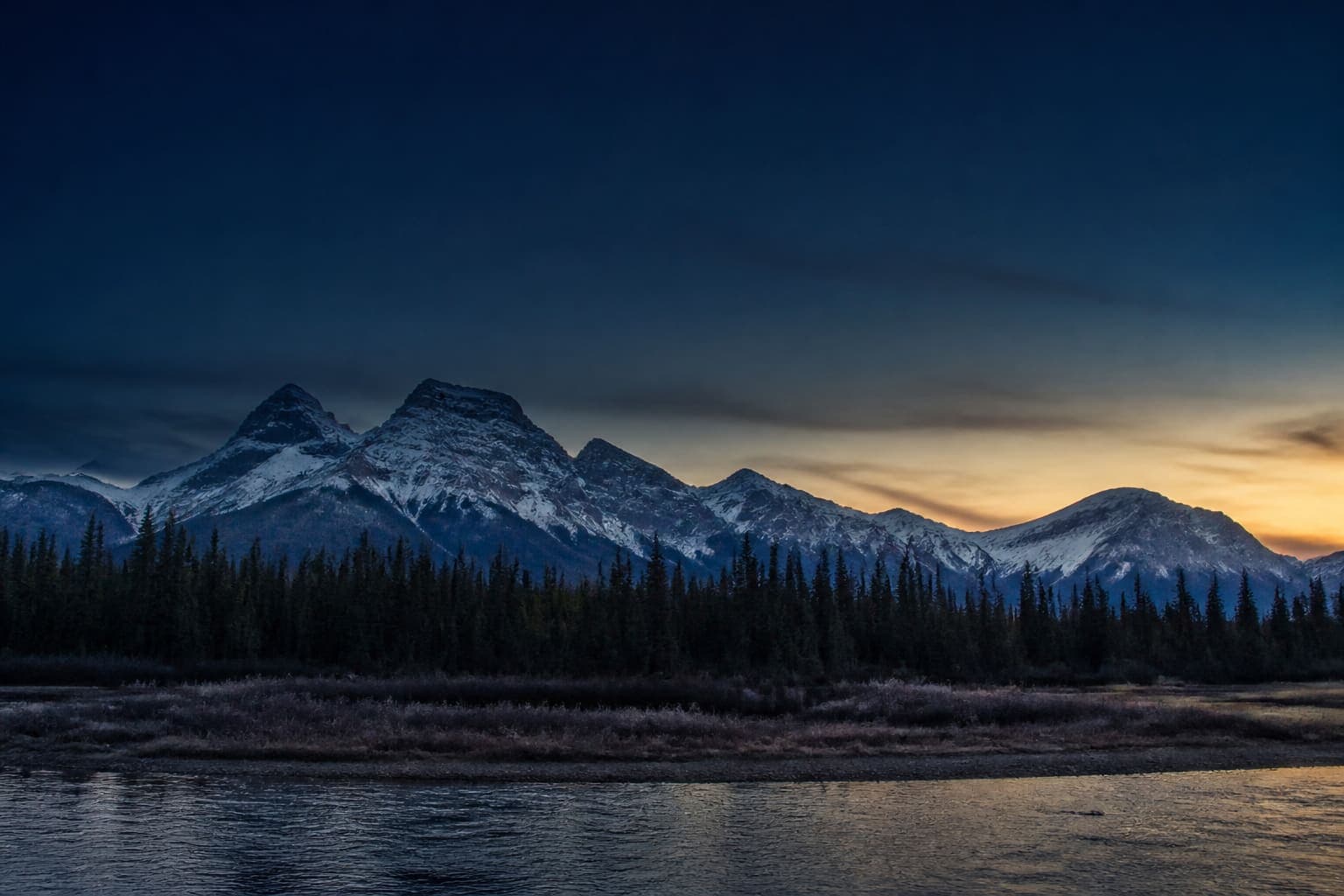 Dusk over the mountains and foothills of Alberta
